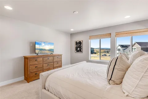 a bedroom with a bed and a dresser