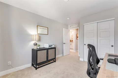 a view of a livingroom with furniture and a window