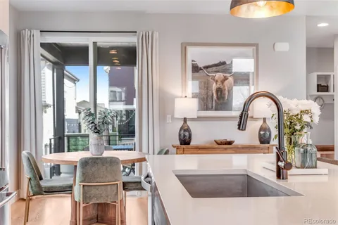 a kitchen with a sink and a large window