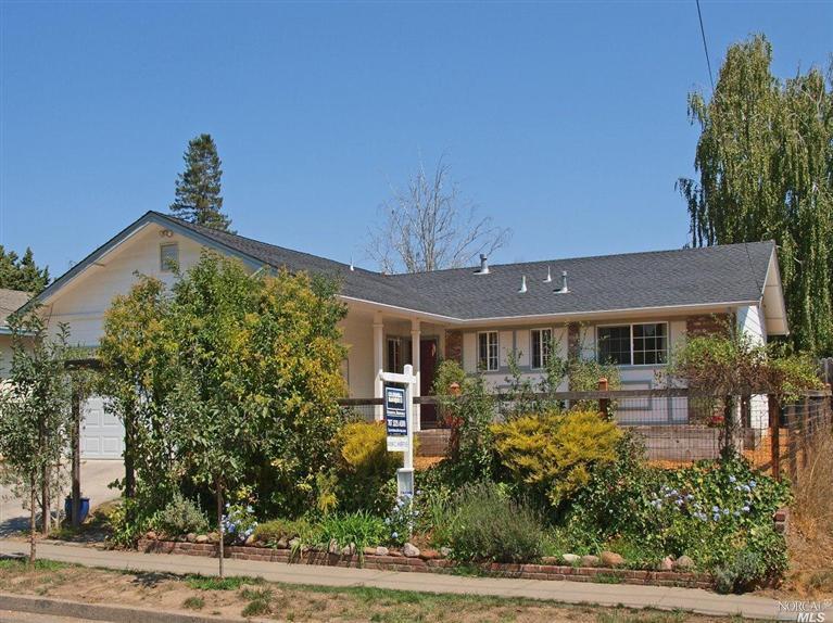 411 Ragle Road Sebastopol, CA 95472 - Photo 1 of 1 a front view of a house with a yard