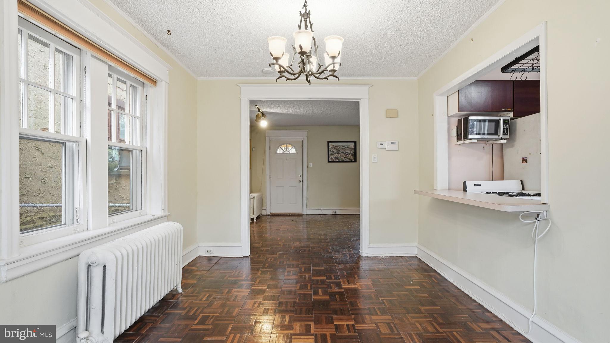 442 Wellesley Road Philadelphia, PA 19119 - Photo 11 of 36 a view of a hallway with a chandelier