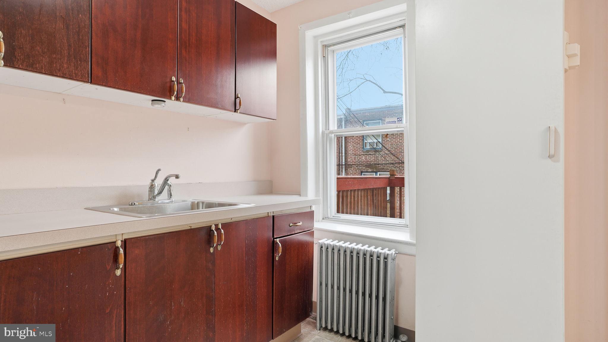 442 Wellesley Road Philadelphia, PA 19119 - Photo 16 of 36 a kitchen with a sink and a window