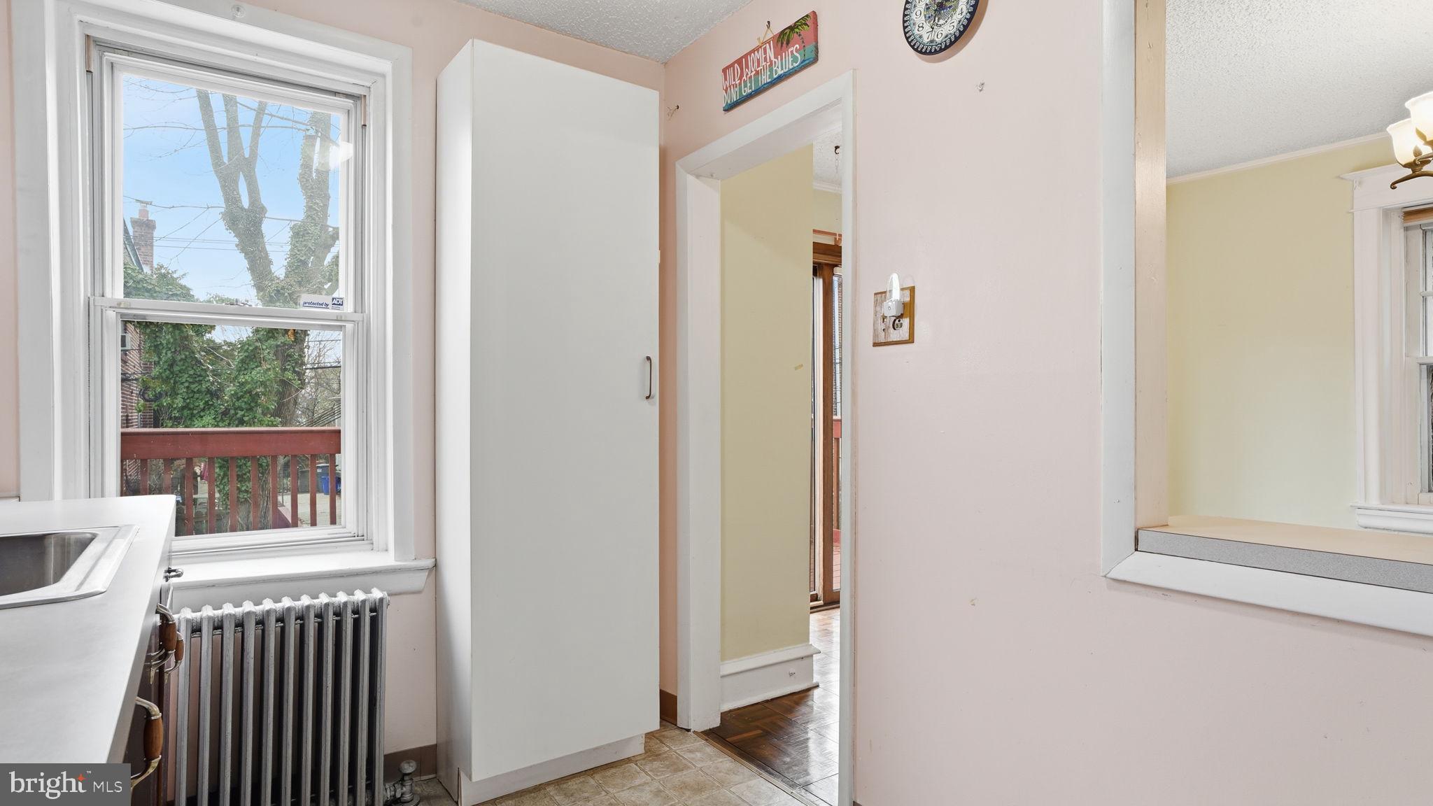 442 Wellesley Road Philadelphia, PA 19119 - Photo 19 of 36 a view of a door and chair in a small bathroom