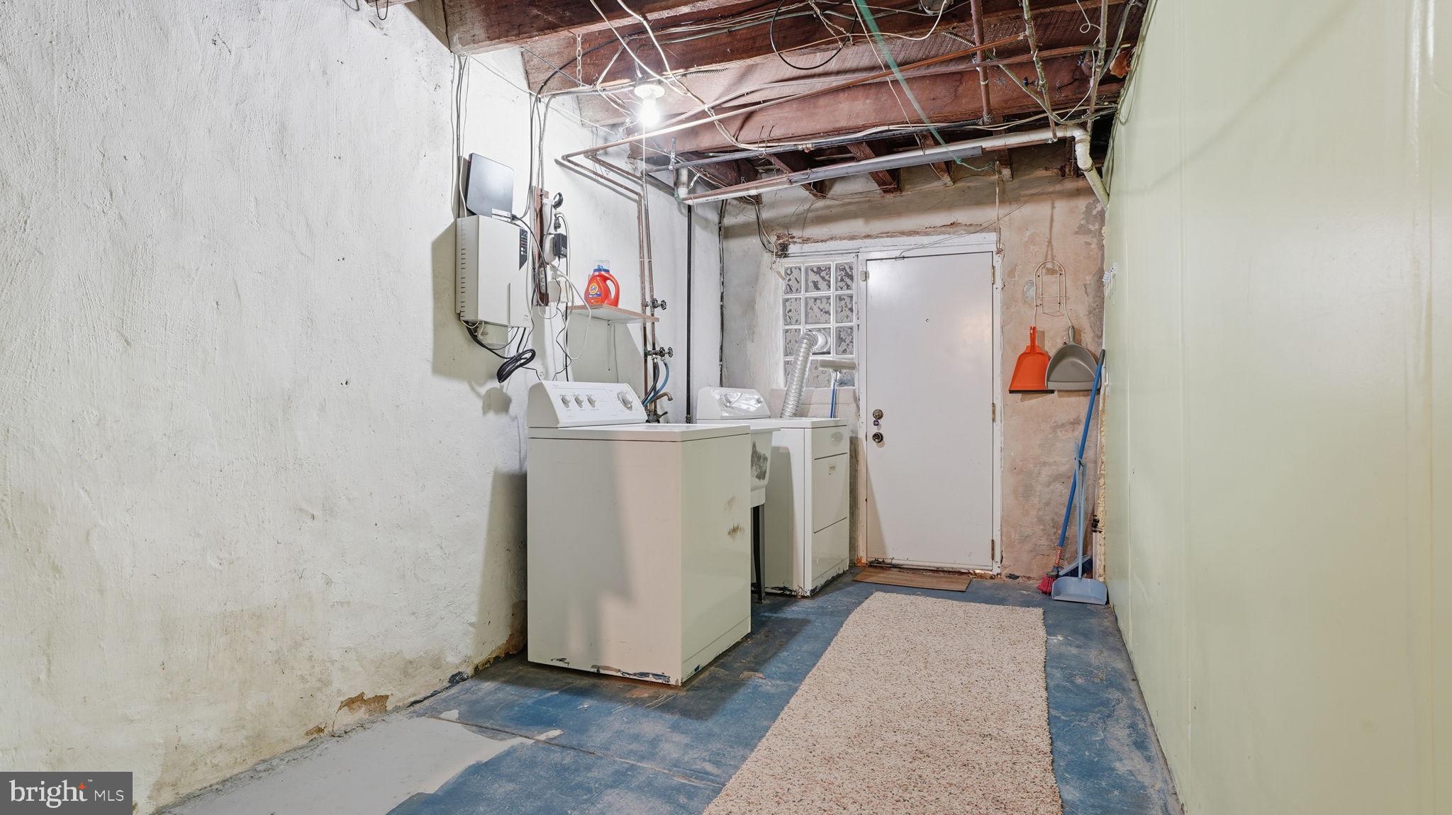 442 Wellesley Road Philadelphia, PA 19119 - Photo 32 of 36 a utility room with dryer and washer