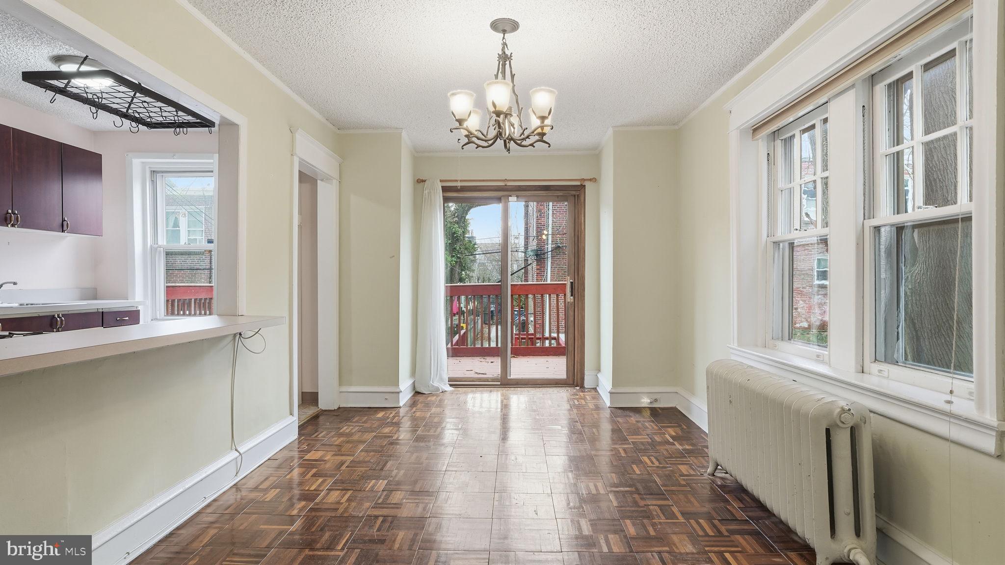 442 Wellesley Road Philadelphia, PA 19119 - Photo 9 of 36 a view of a hallway with windows and chandelier