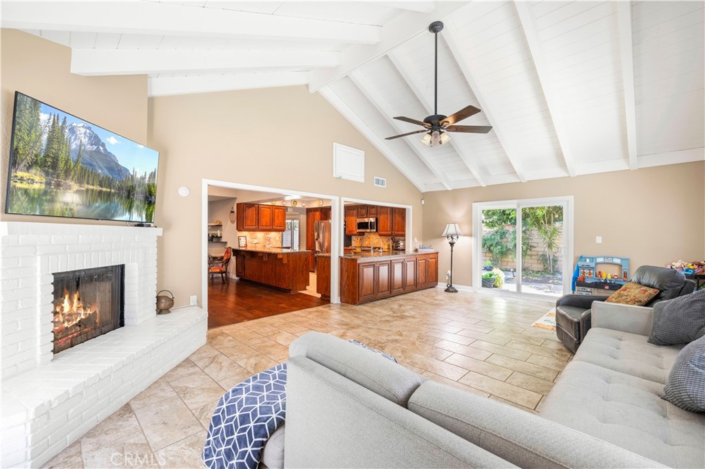 18770 Tribune Street Porter Ranch, CA 91326 - Photo 11 of 30 a living room with furniture fireplace and flat screen tv