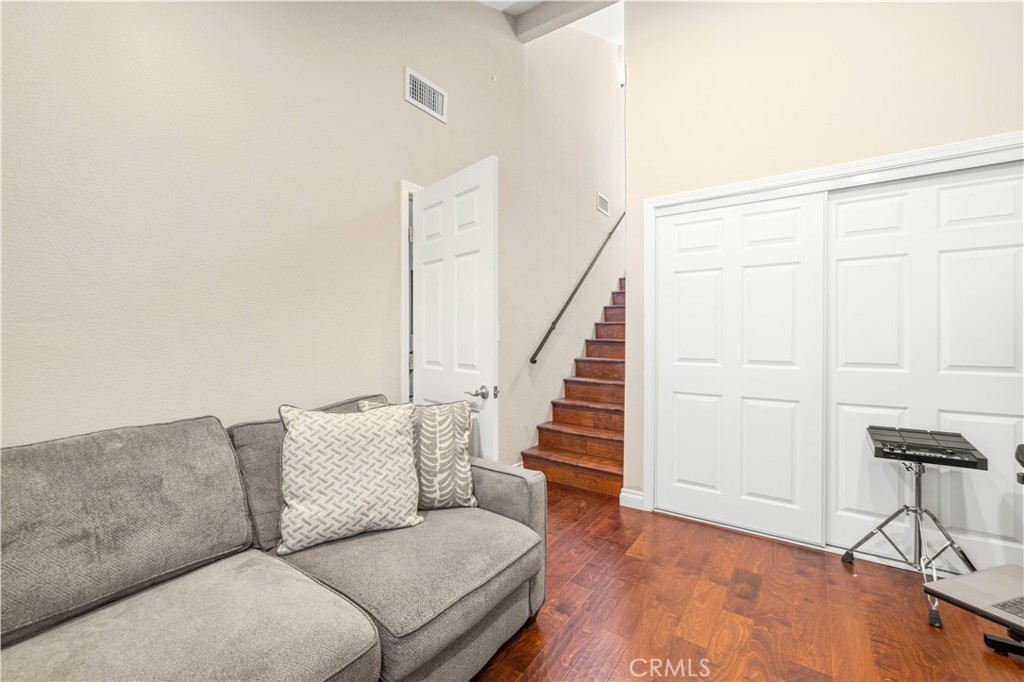 18770 Tribune Street Porter Ranch, CA 91326 - Photo 12 of 30 a living room with furniture and a wooden floor