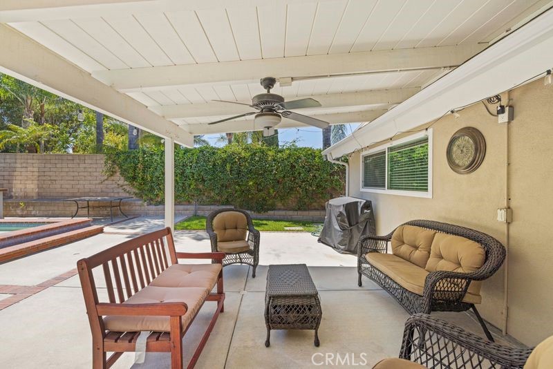 18770 Tribune Street Porter Ranch, CA 91326 - Photo 22 of 30 a view of a patio with a dining table and chairs