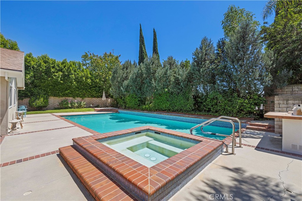 18770 Tribune Street Porter Ranch, CA 91326 - Photo 24 of 30 a view of a tennis ground with large trees