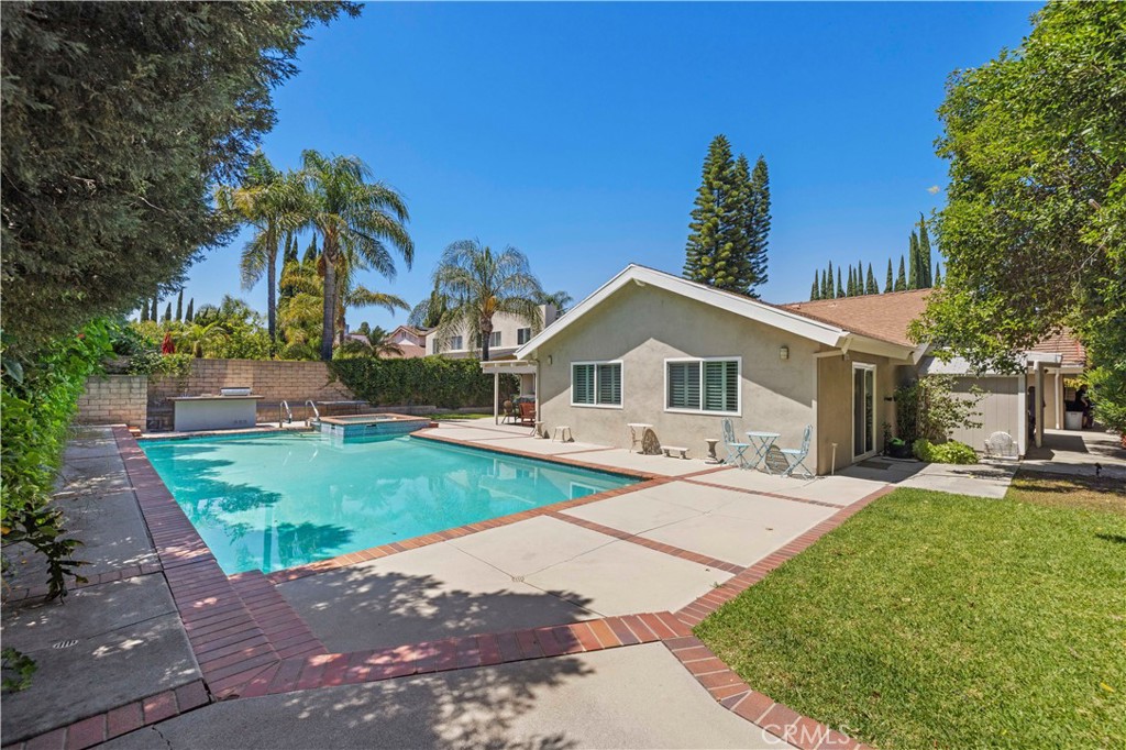 18770 Tribune Street Porter Ranch, CA 91326 - Photo 25 of 30 a front view of house with yard and green space
