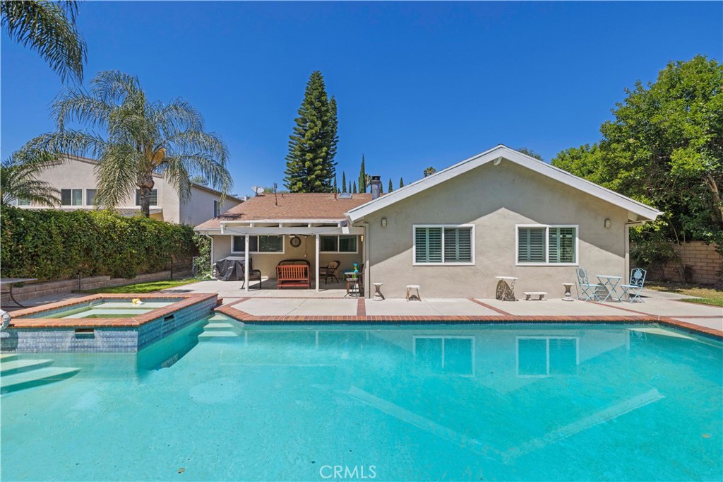 18770 Tribune Street Porter Ranch, CA 91326 - Photo 27 of 30 a view of a house with pool and sitting area