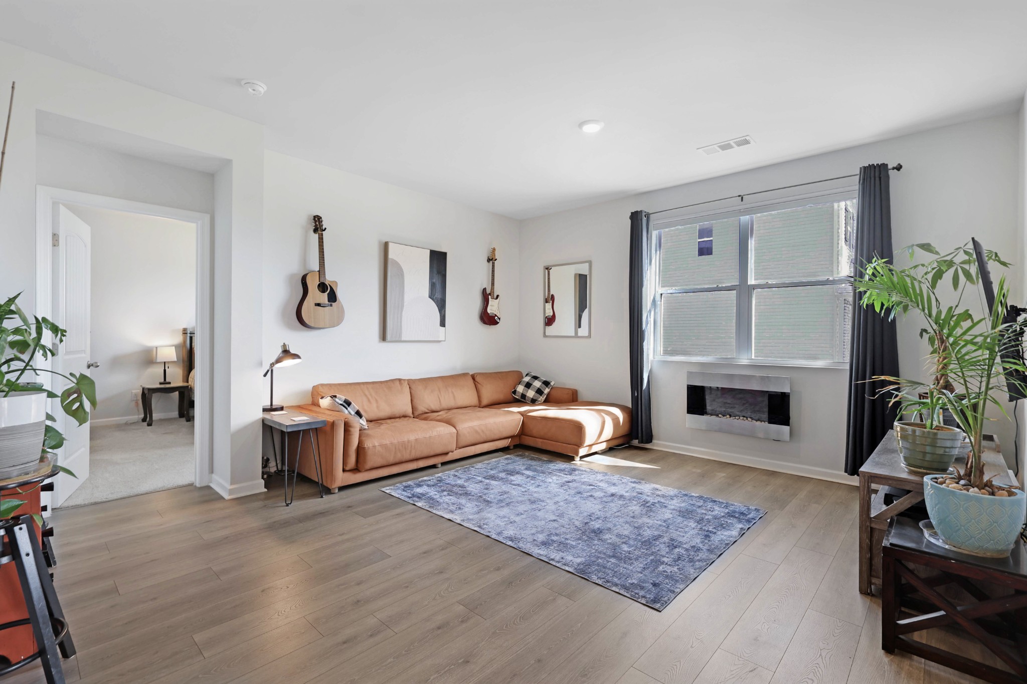 7764 Stapleton Chase Drive Antioch, TN 37013 - Photo 11 of 31 a living room with furniture fireplace and potted plant
