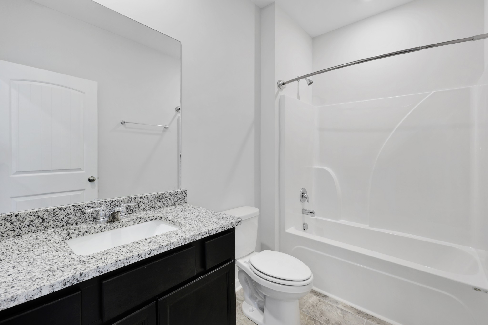 7764 Stapleton Chase Drive Antioch, TN 37013 - Photo 26 of 31 a bathroom with a granite countertop sink toilet and shower