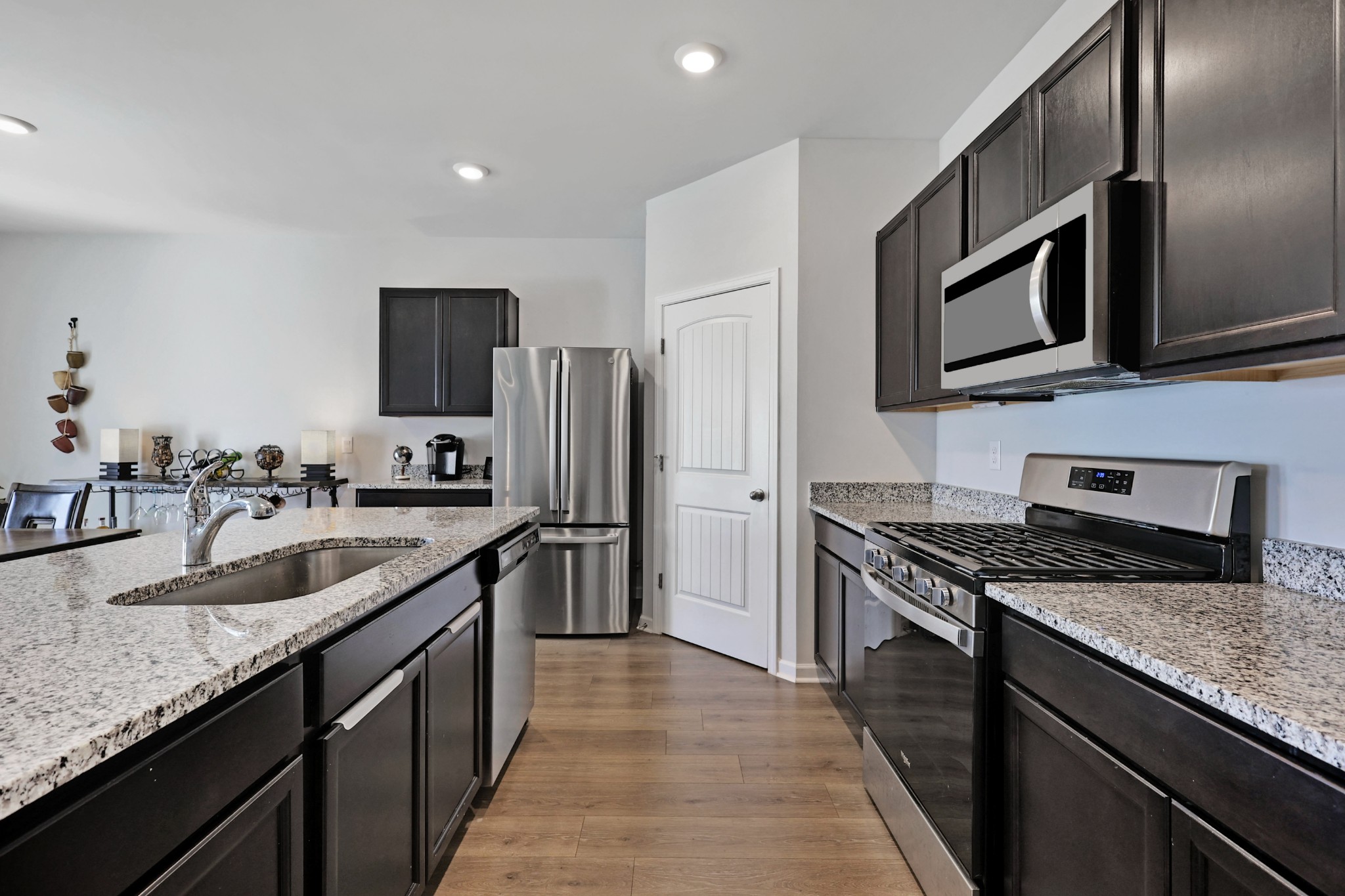 7764 Stapleton Chase Drive Antioch, TN 37013 - Photo 5 of 31 a kitchen with stainless steel appliances granite countertop a sink stove and refrigerator