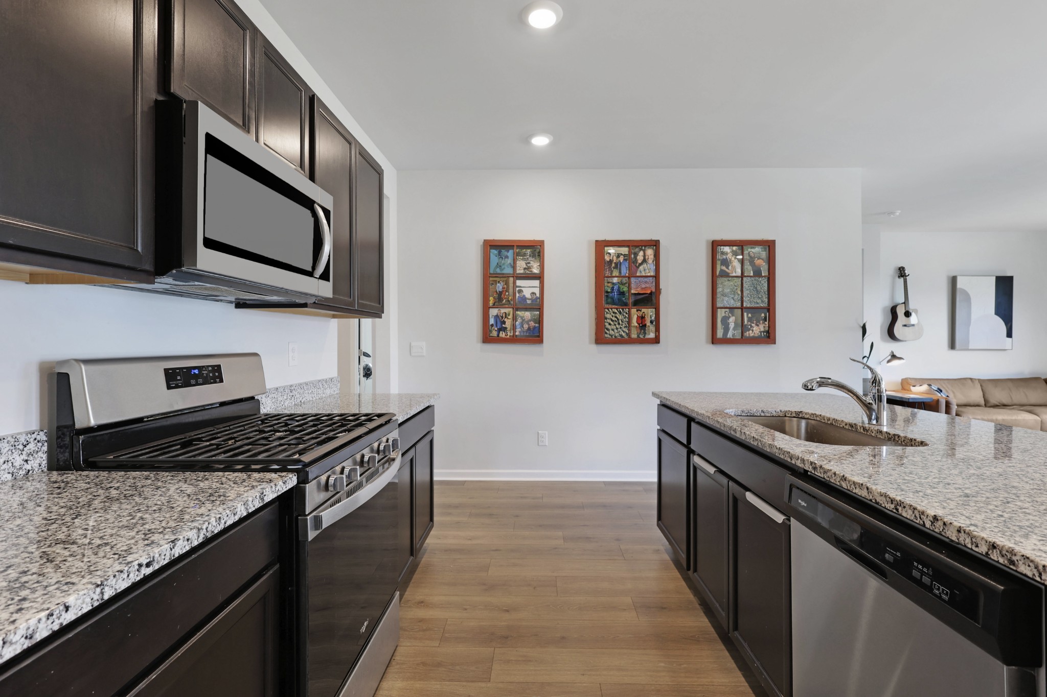 7764 Stapleton Chase Drive Antioch, TN 37013 - Photo 6 of 31 a kitchen with stainless steel appliances granite countertop a stove top oven a sink a counter space and cabinets