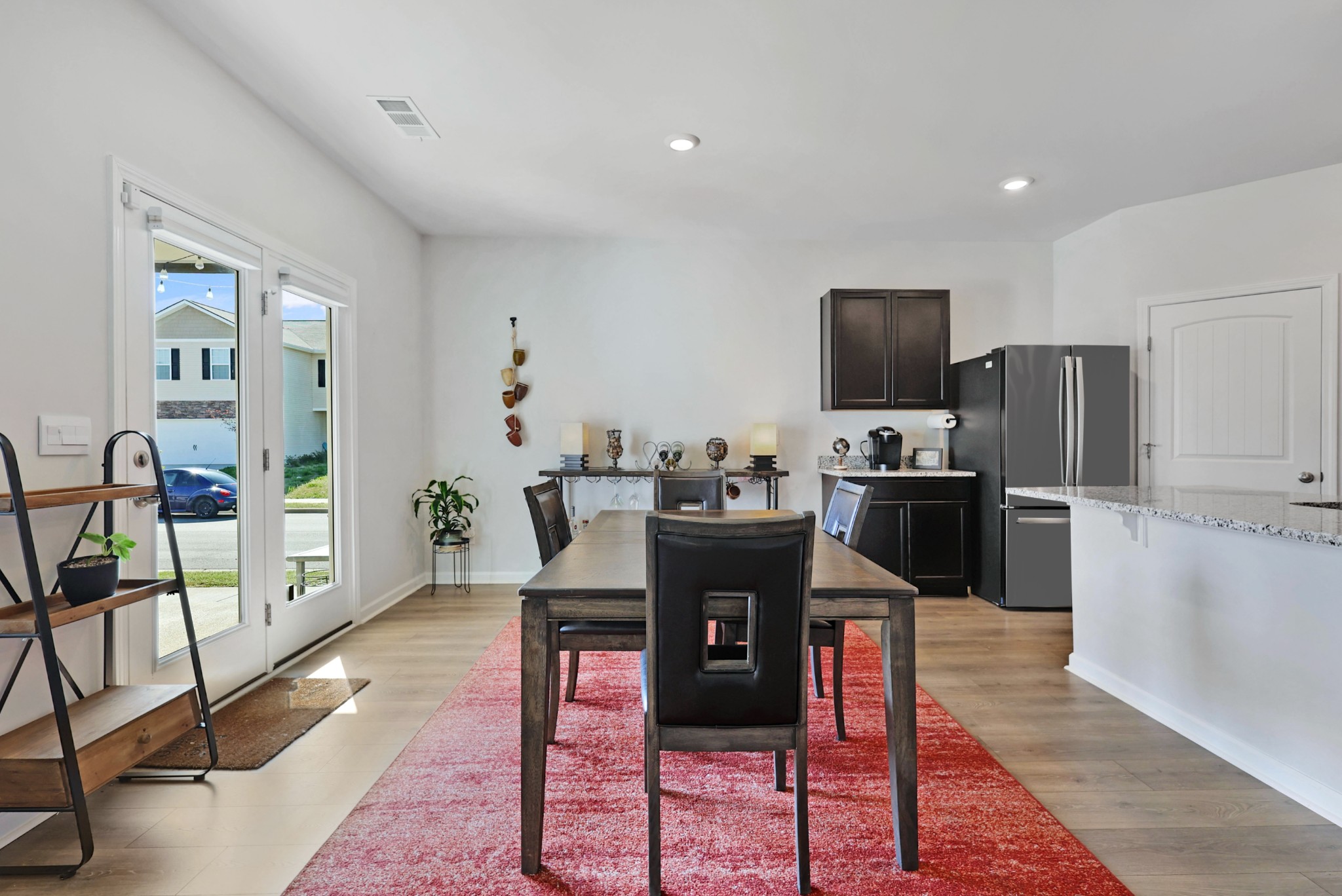 7764 Stapleton Chase Drive Antioch, TN 37013 - Photo 8 of 31 a living room with stainless steel appliances furniture a dining table and kitchen view