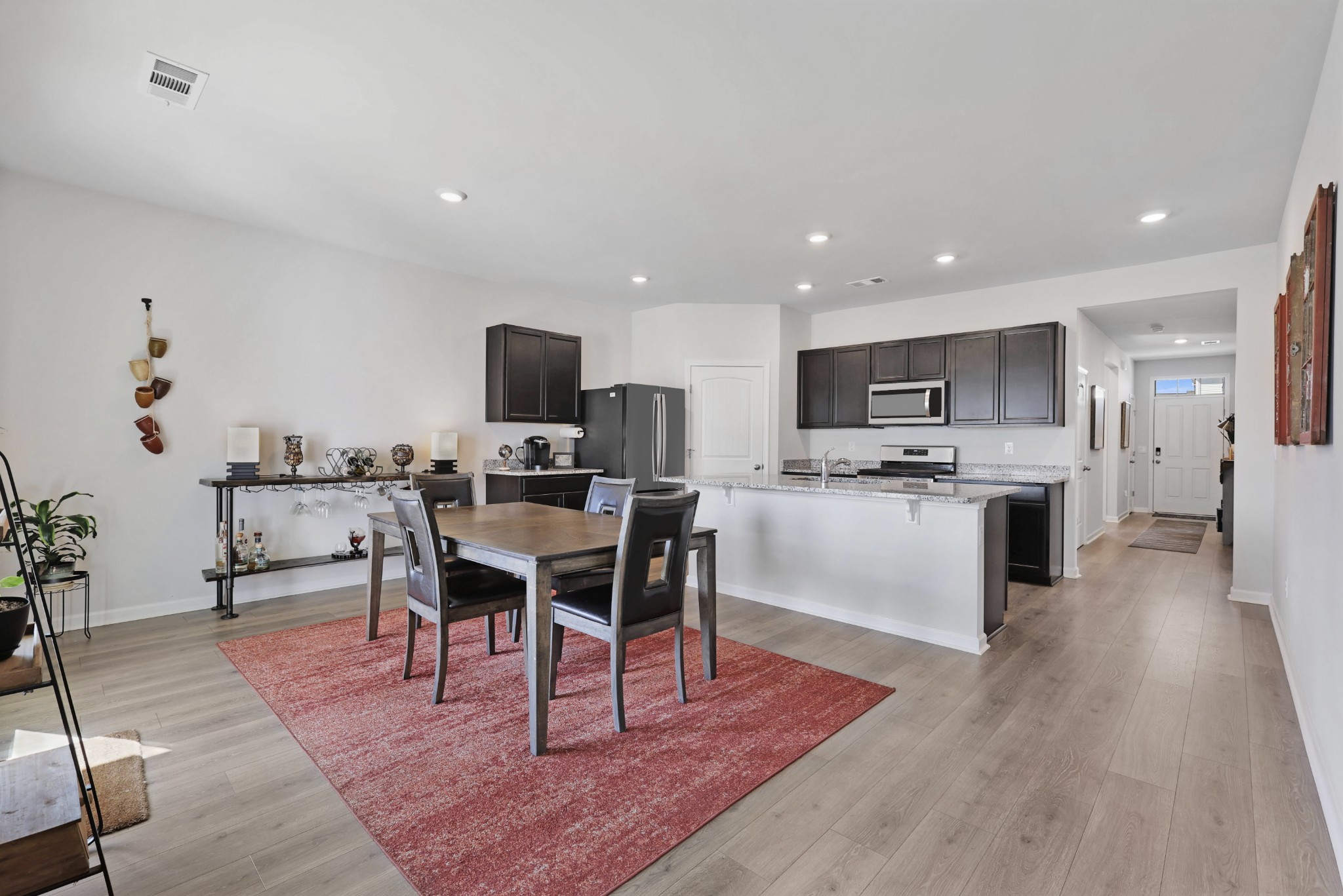 7764 Stapleton Chase Drive Antioch, TN 37013 - Photo 9 of 31 a living room with stainless steel appliances furniture wooden floor and a kitchen view
