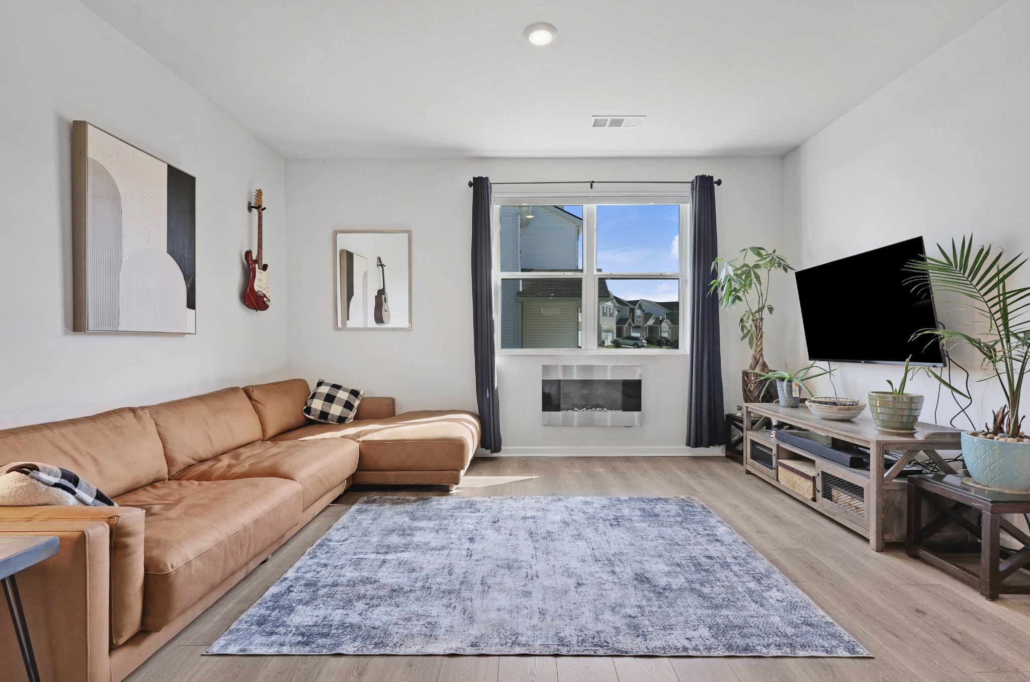 7764 Stapleton Chase Drive Antioch, TN 37013 - Photo 10 of 31 a living room with furniture and a flat screen tv