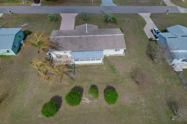 a view of a swimming pool with a yard