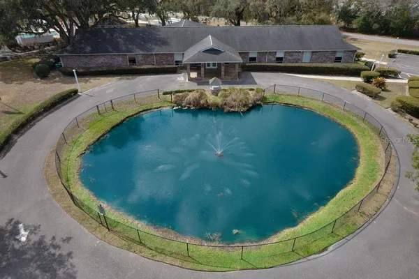 a view of a livingroom with furniture and a large window