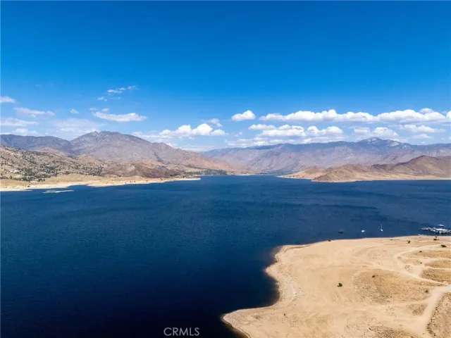 a view of a large body of water with a mountain in the background