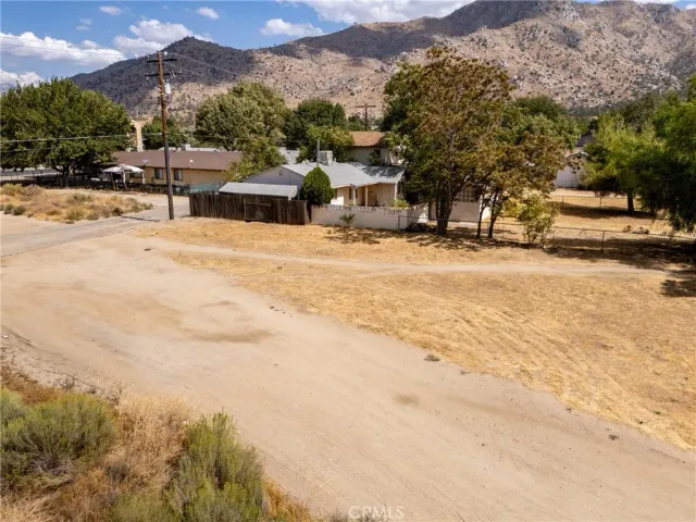 a view of a town with mountains in the background