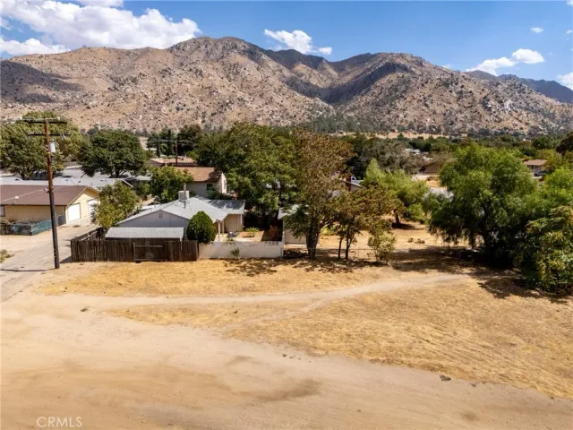 a view of residential houses with outdoor space