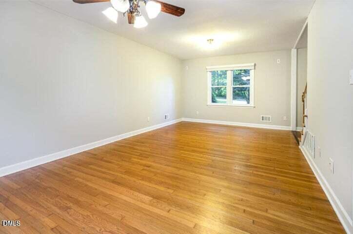 3209 Marie Drive Raleigh, NC 27604 - Photo 11 of 40 wooden floor in an empty room with a window