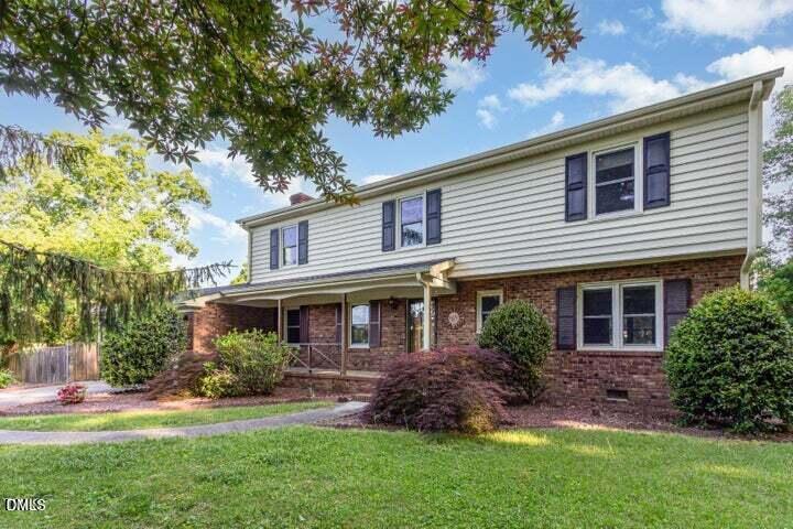 3209 Marie Drive Raleigh, NC 27604 - Photo 2 of 40 a front view of a house with a garden