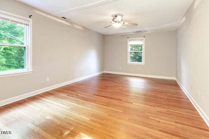3209 Marie Drive Raleigh, NC 27604 - Photo 22 of 40 a view of an empty room with wooden floor and a window