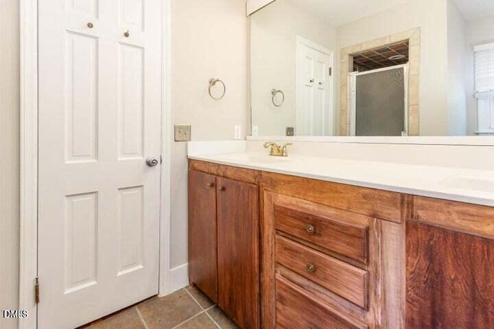 3209 Marie Drive Raleigh, NC 27604 - Photo 23 of 40 a bathroom with a sink and a mirror