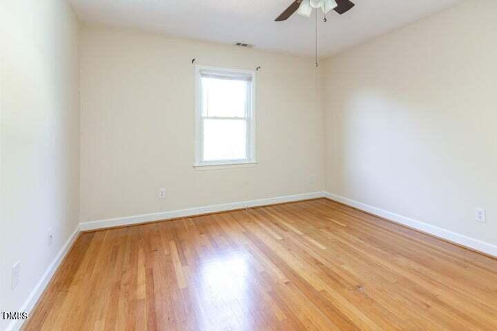 3209 Marie Drive Raleigh, NC 27604 - Photo 26 of 40 an empty room with a window and wooden floor
