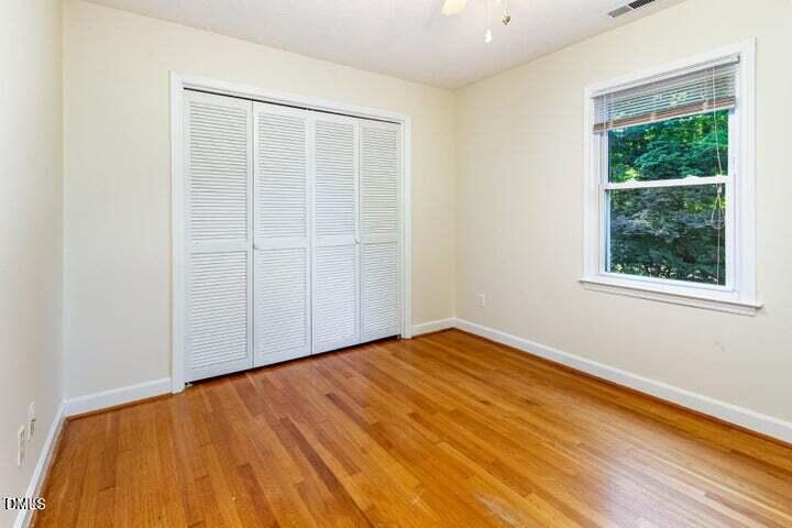 3209 Marie Drive Raleigh, NC 27604 - Photo 27 of 40 a view of an empty room with wooden floor and a window