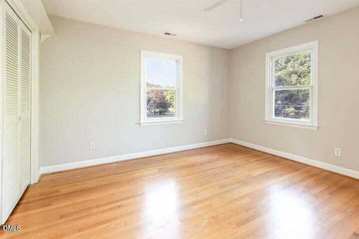 3209 Marie Drive Raleigh, NC 27604 - Photo 28 of 40 a view of an empty room with wooden floor and a window