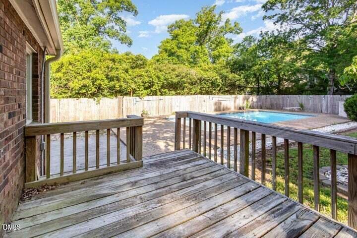 3209 Marie Drive Raleigh, NC 27604 - Photo 33 of 40 a balcony with wooden floor and fence
