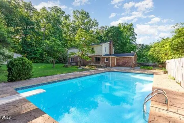 a view of a swimming pool with a patio