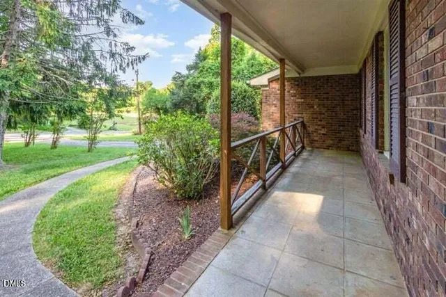 a view of a pathway with a backyard