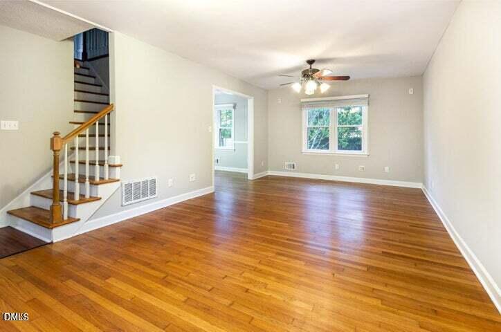 3209 Marie Drive Raleigh, NC 27604 - Photo 8 of 40 a view of an empty room with wooden floor and a window