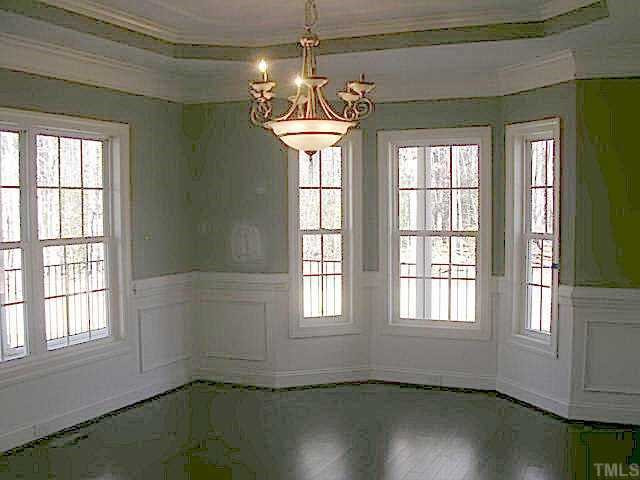 15004 Westerfield Road Wake Forest, NC 27587 - Photo 3 of 10 Spacious formal dining room with bay window, wainscotting, crown molding and hardwood floors. Other