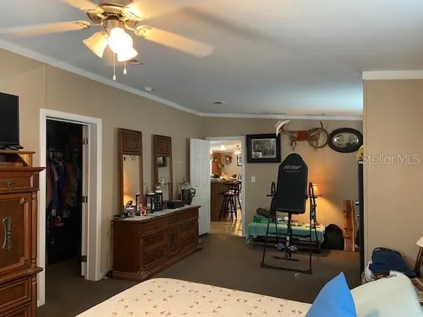 a room with gym equipment and large mirror