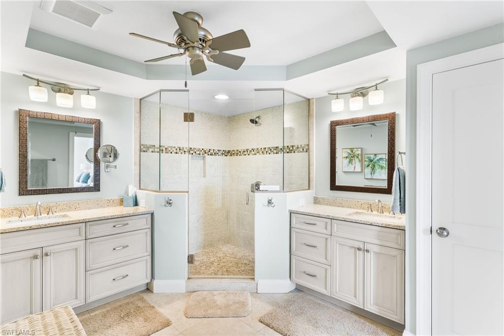 4975 Bonita Beach Road Southwest Bonita Springs, FL 34134 - Photo 23 of 49 Two separate vanities, quartz counters, custom shower tile, pebble shower floor, newer lighting/plumbing fixtures