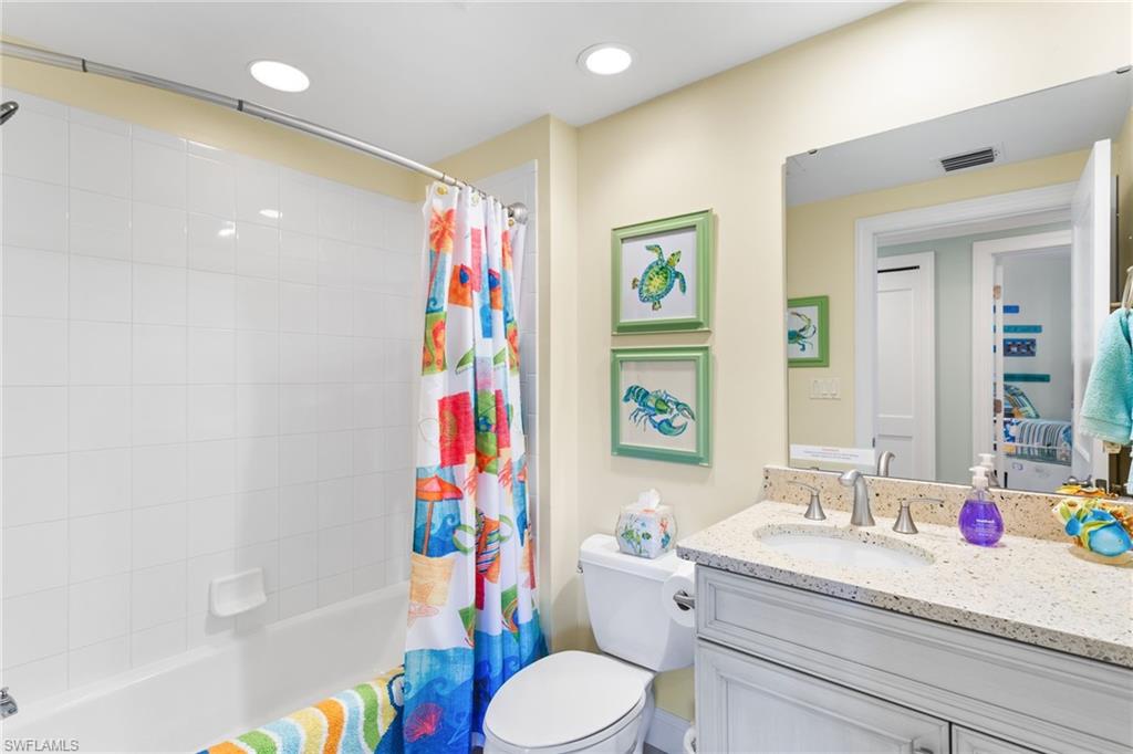 4975 Bonita Beach Road Southwest Bonita Springs, FL 34134 - Photo 26 of 49 Guest bathroom with new vanity, combination tub/shower.