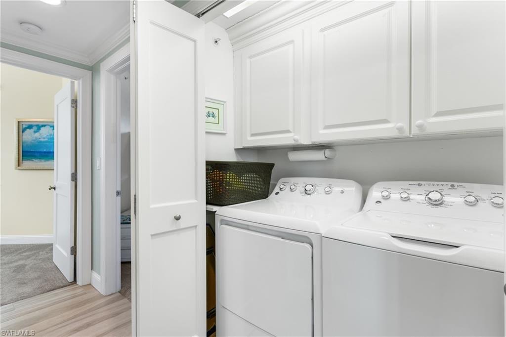 4975 Bonita Beach Road Southwest Bonita Springs, FL 34134 - Photo 29 of 49 Laundry closet with additional cabinets for storage.