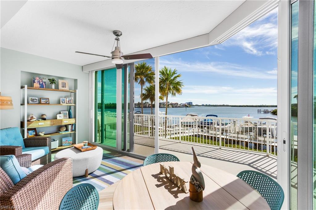 4975 Bonita Beach Road Southwest Bonita Springs, FL 34134 - Photo 5 of 49 Wall to wall, floor to ceiling impact sliders complete with screens to let the breeze in!