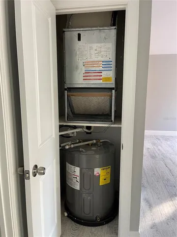 wooden floor and closet area with wooden floor