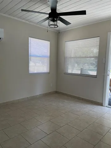a kitchen with cabinets and white stainless steel appliances