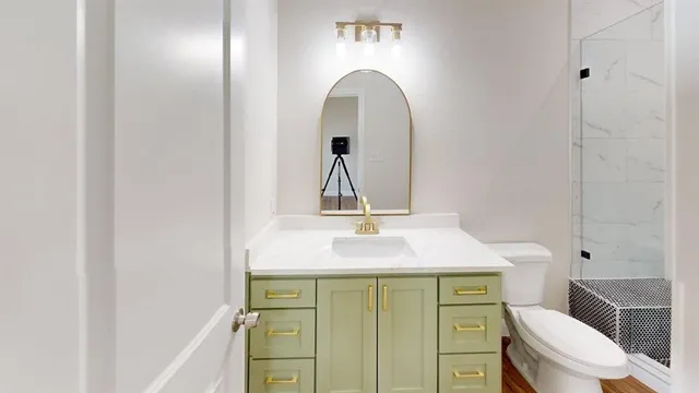 a bathroom with a sink and a mirror