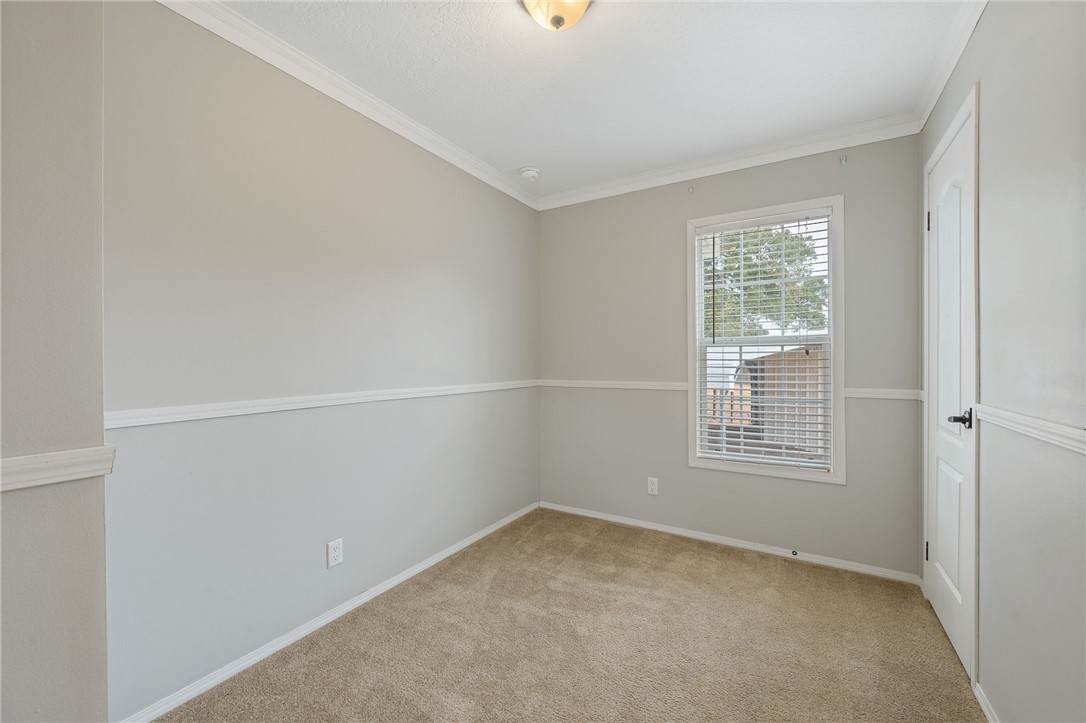 9144 Hensarling Lane Bryan, TX 77808 - Photo 13 of 25 an empty room with a window
