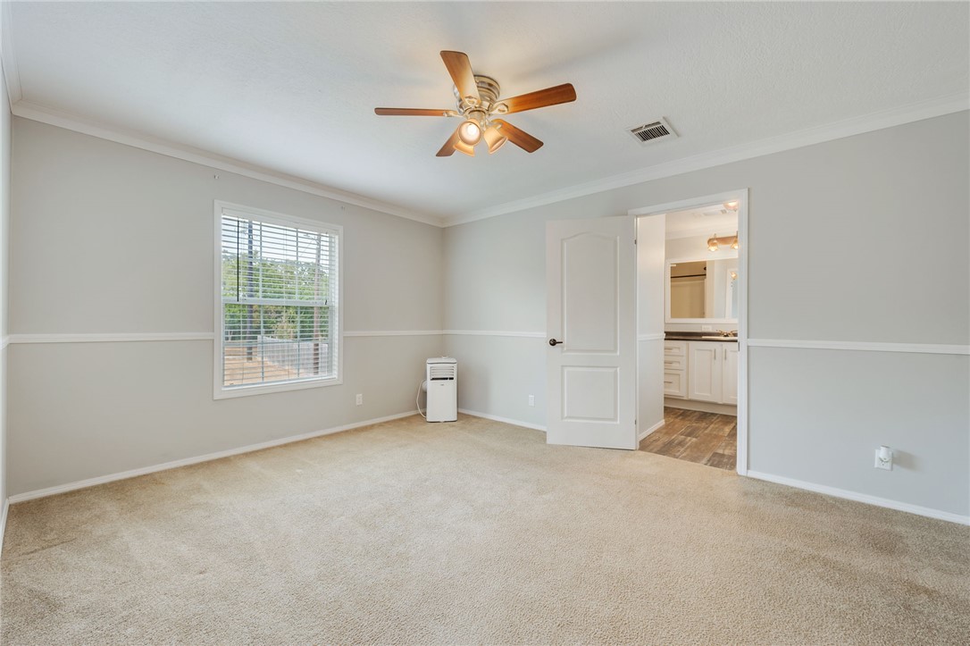 9144 Hensarling Lane Bryan, TX 77808 - Photo 14 of 25 an empty room with closet and windows