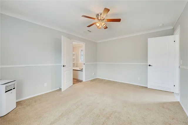 a view of a livingroom with a ceiling fan